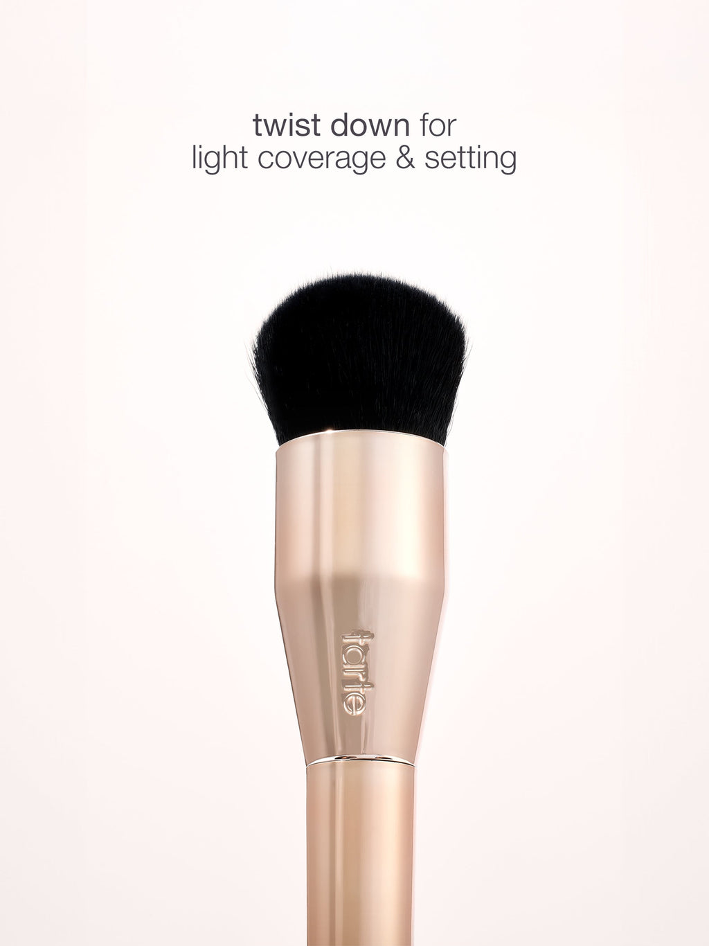 Makeup brush with black bristle tip on a white background, featuring the brand 'e.l.f.'