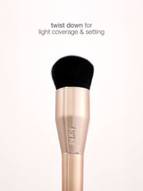 Makeup brush with black bristle tip on a white background, featuring the brand 'e.l.f.'