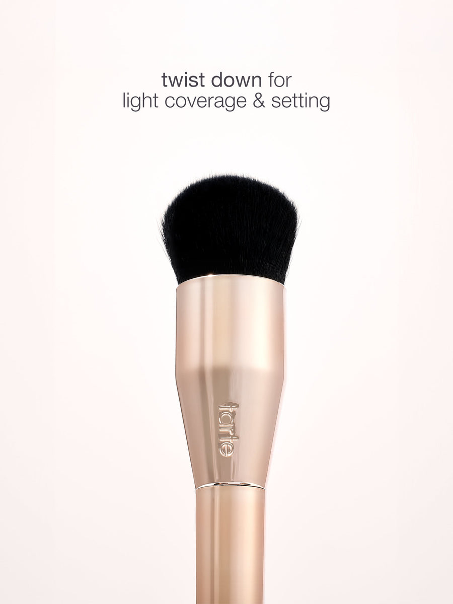 Makeup brush with black bristle tip on a white background, featuring the brand 'e.l.f.'