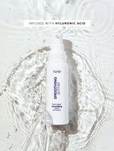 Tarte smoothing primer bottle with hyluronic acid text on a white background