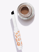 Eyebrow gel with applicator on a white background