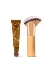 Tarte sculpt tape and makeup brush on a white background