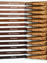 Set of brown hair color tubes with labels on a white background