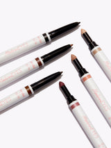 Set of makeup pencils with visible brand name on a white background