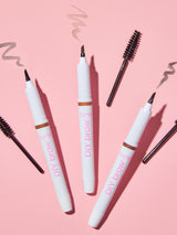 Set of 'Huda Beauty DIY Brow' products on a pink background
