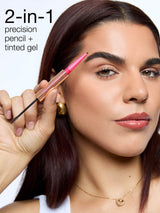 Woman using a 2-in-1 precision pencil and tinted gel product on her face.