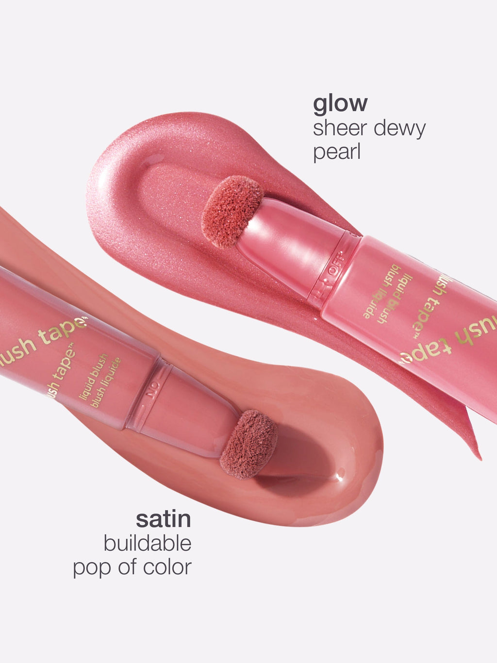 Pink lip gloss with applicator on a white background