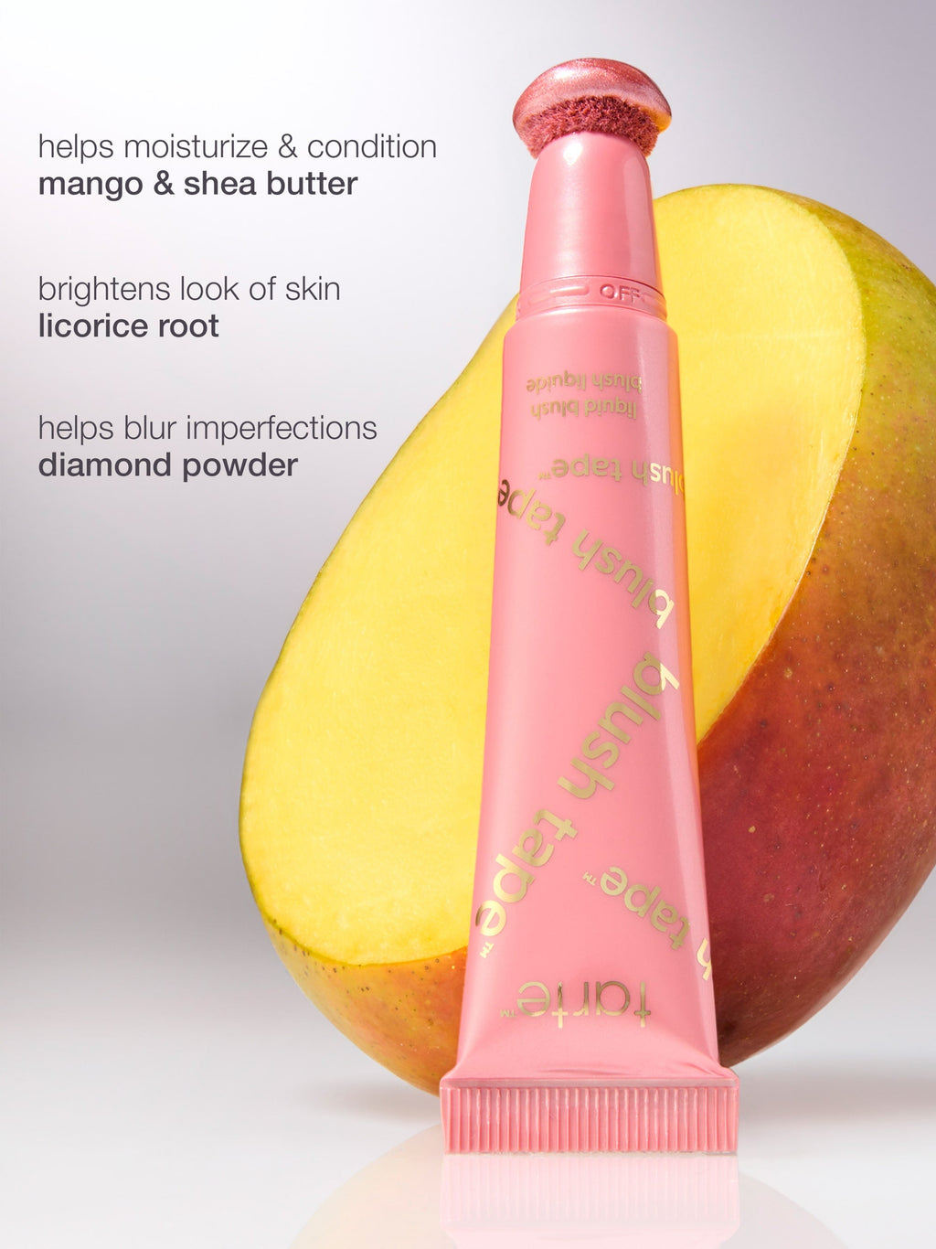 Pink skincare product with mango and shea butter on a light gray background