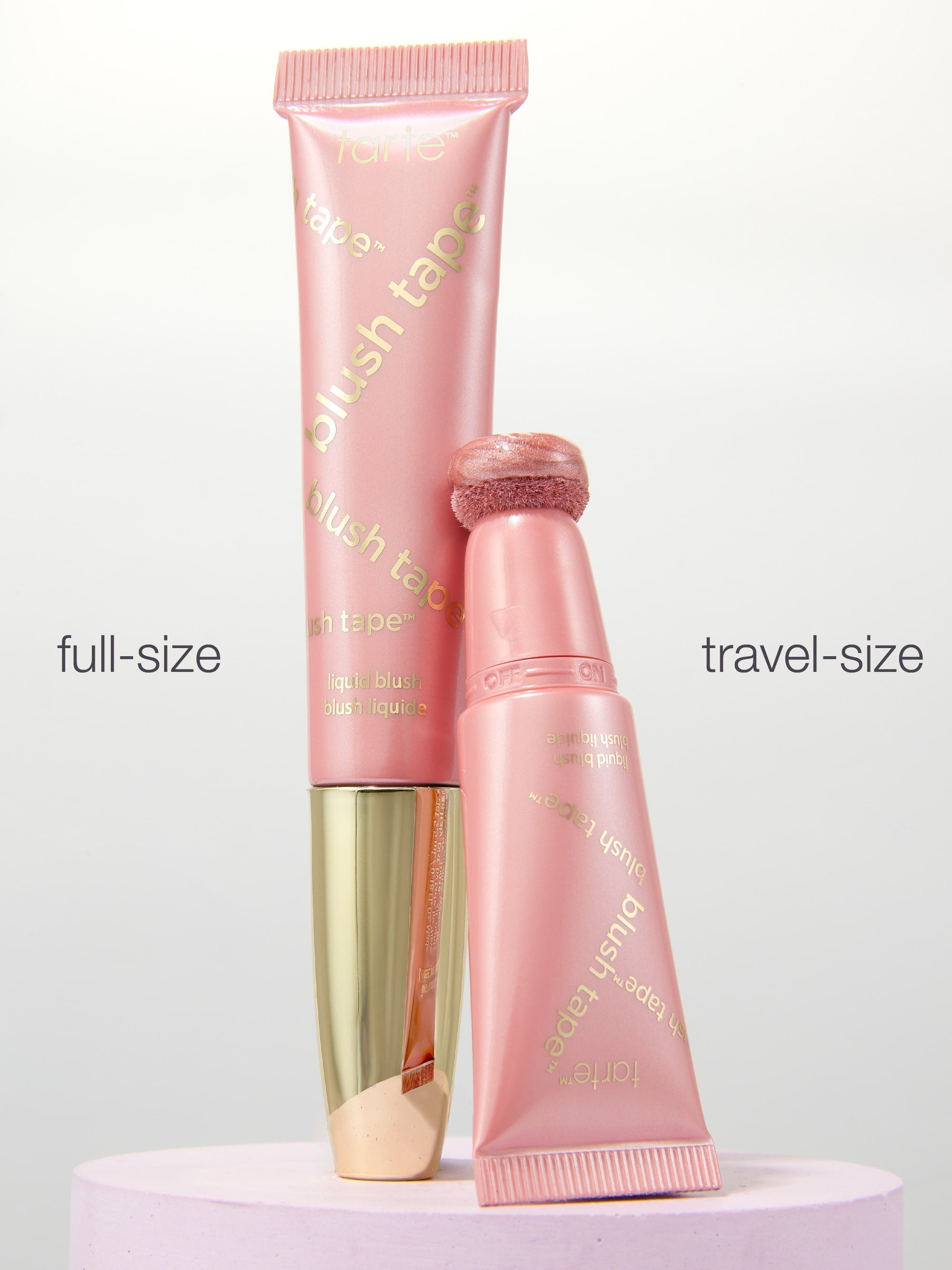 Full-size and travel-size blush tube on a white background