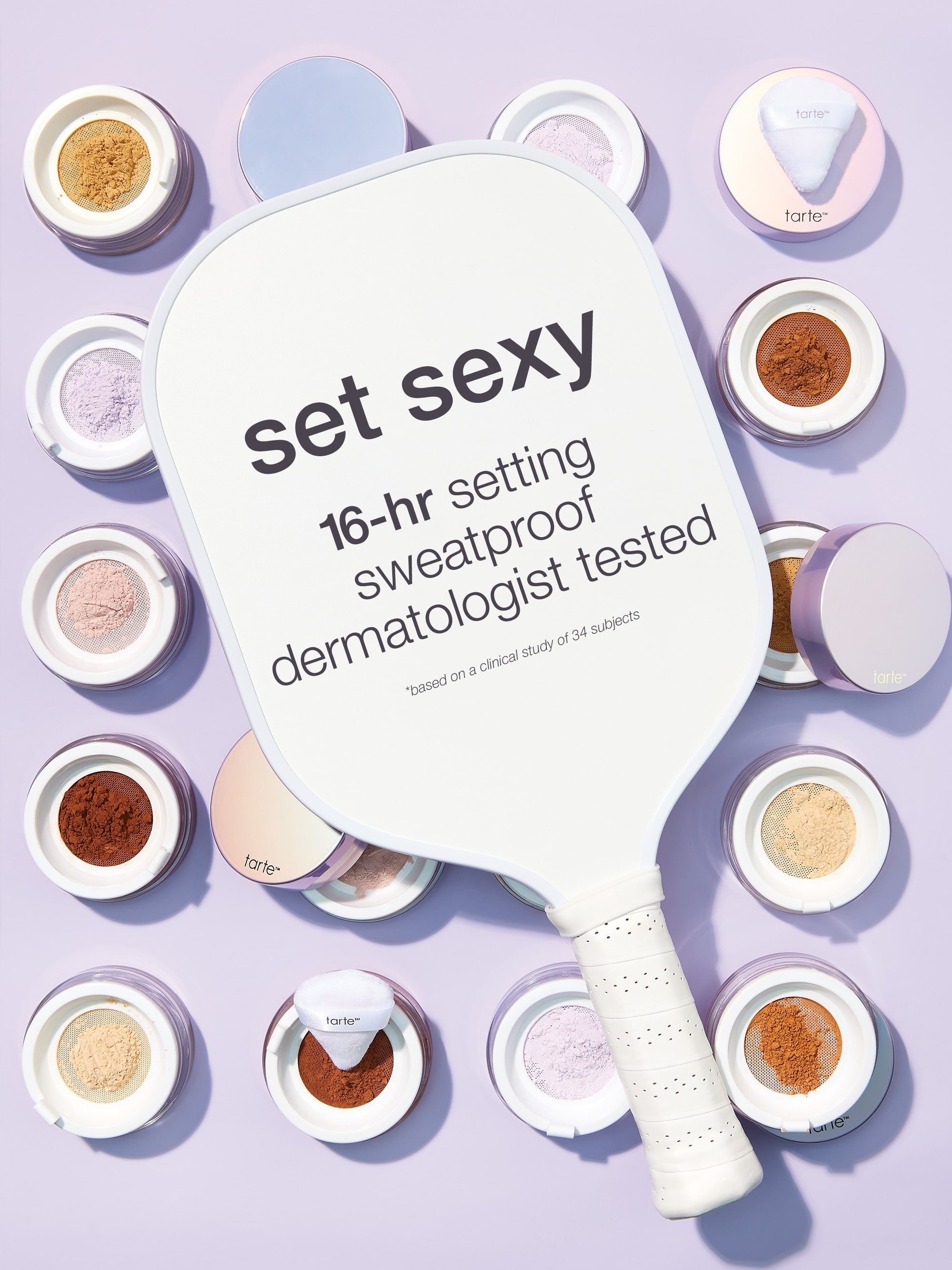 Makeup setting powder paddle with 'set sexy' text on a purple background