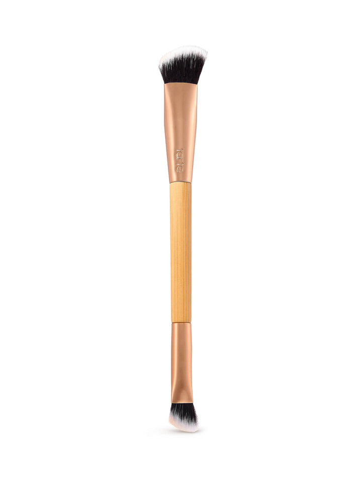 Makeup brush with black bristles on a white background