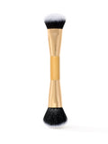 tarte Makeup brush with black bristles on a white background