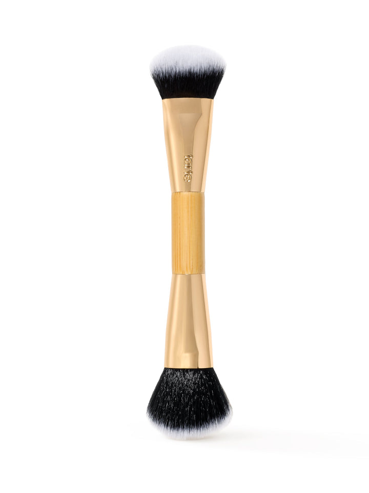 tarte Makeup brush with black bristles on a white background