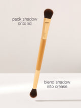 Makeup brush with text instructions on a light gray background