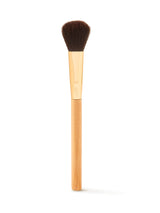 Makeup brush with wooden handle and black bristles on a white background