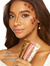 Woman with makeup tape on her face, promoting blush and sculpt tape.