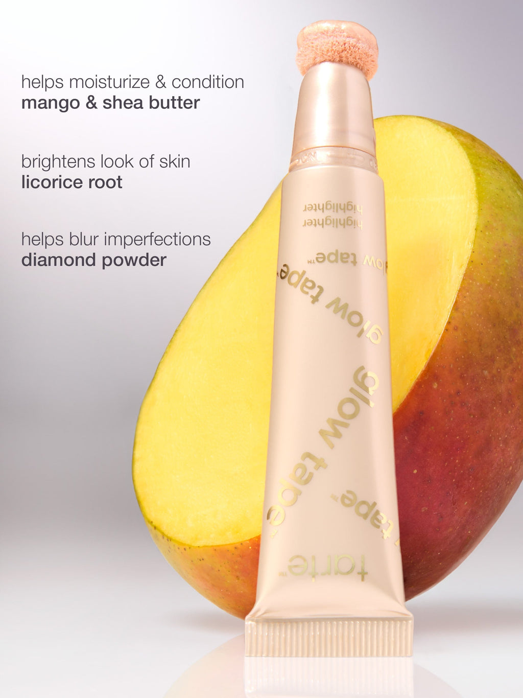 Skincare product with ingredients listed next to a mango on a gray background