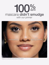Advertisement for mascara and primer showing a close-up of a woman's face with text indicating product effectiveness.