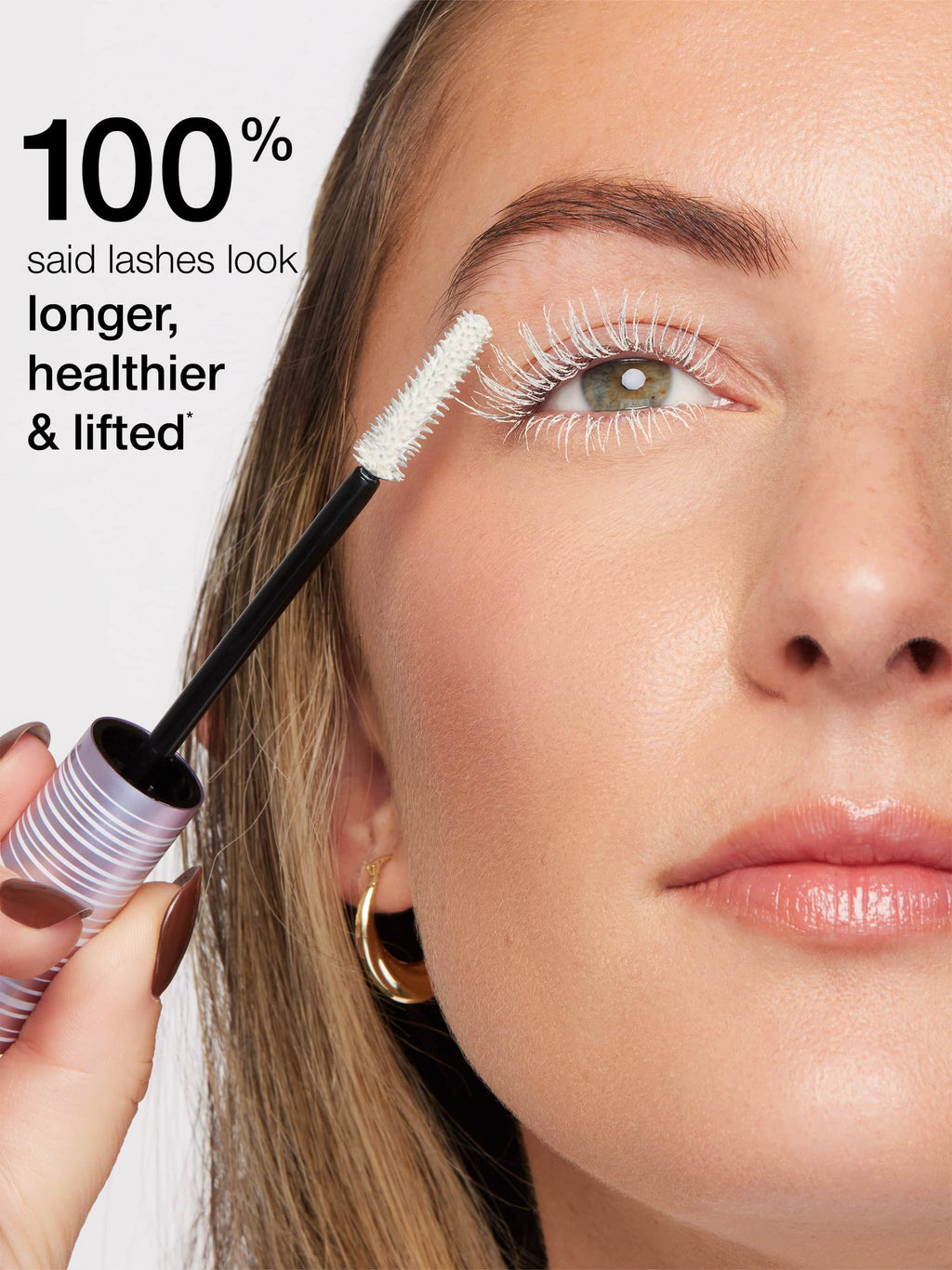 Woman applying mascara with text indicating lash results