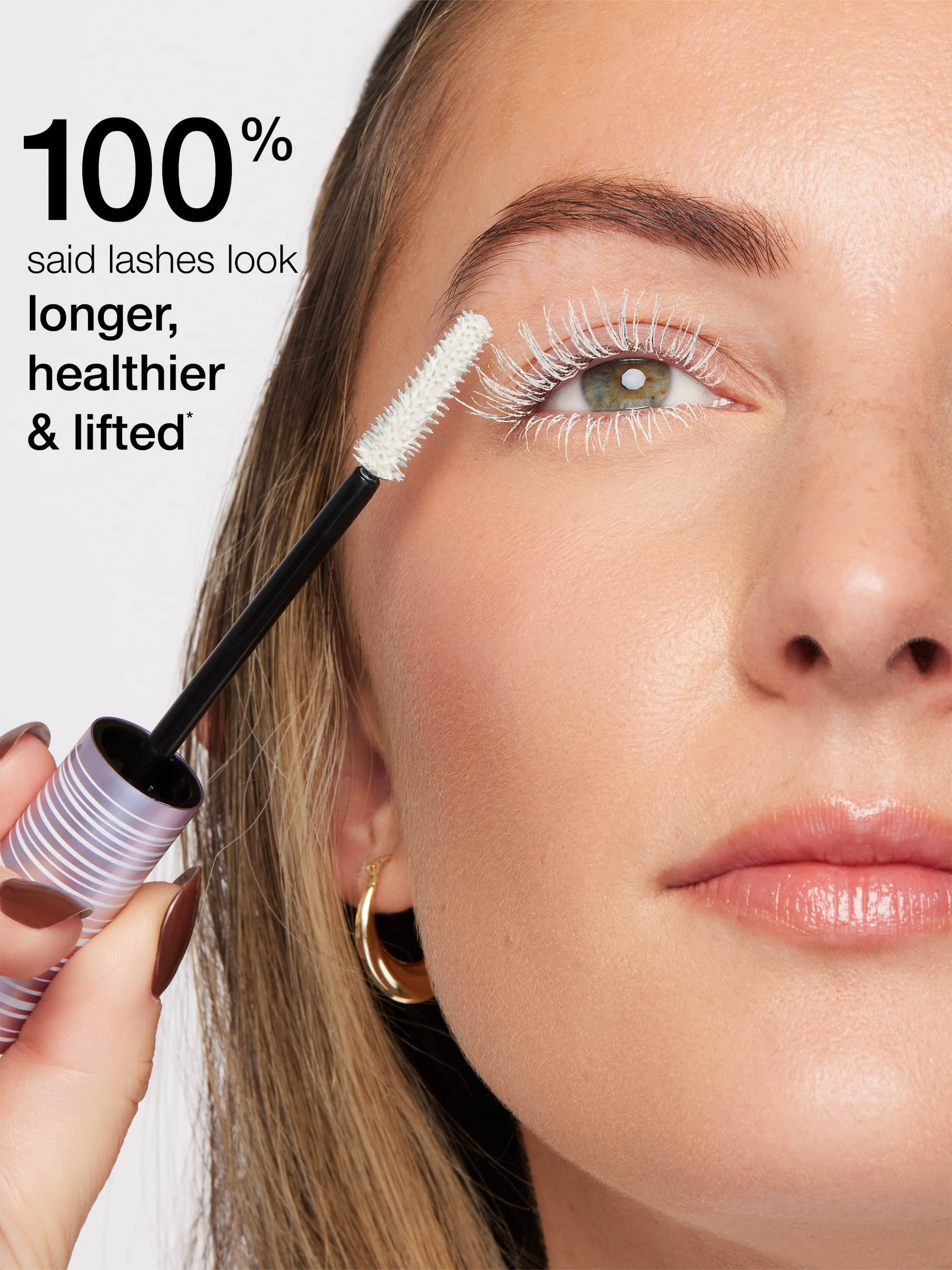 Woman applying mascara with text indicating lash results