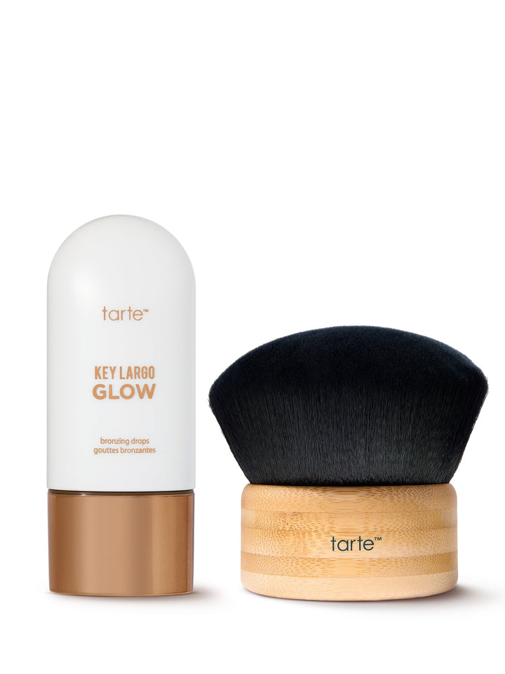 Tarte makeup product with black brush on a white background
