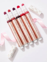 Set of tarte maracuja juicy lip plumping oils with visible brand name on a light background