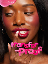 Close-up of a woman's face with pink makeup and text overlay