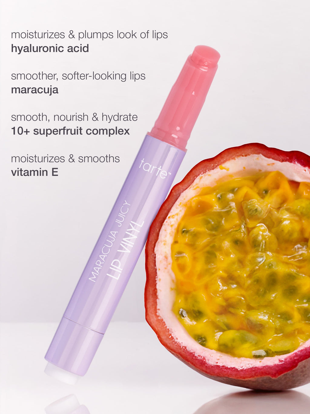 Lip balm with maracuja flavor next to a passion fruit on a white background
