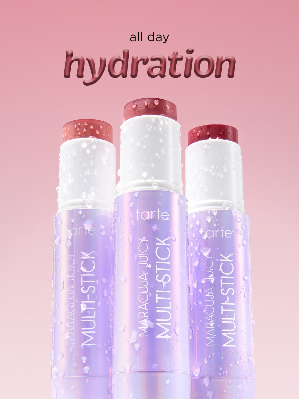 Tarte Multi-Stick lip products on a pink background with 'all day hydration' text.