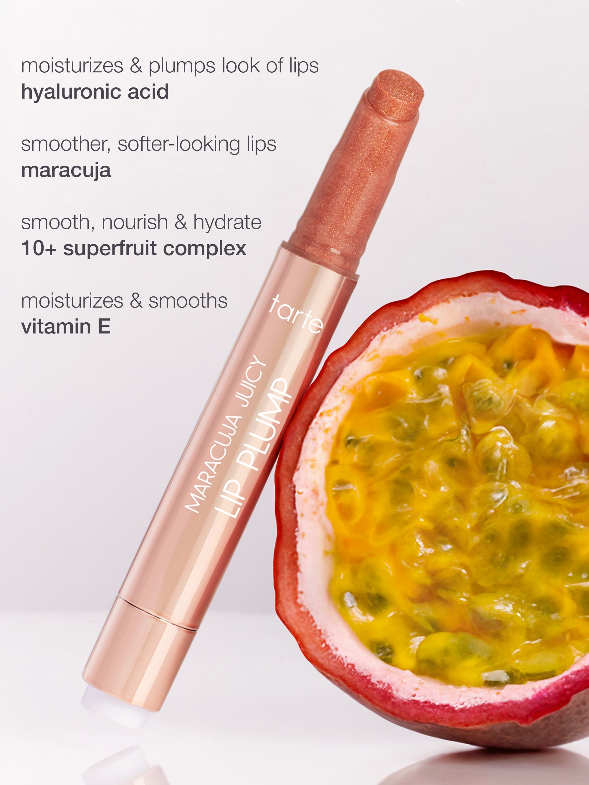 Tarte Maracuja Lip Plump with a passion fruit on a white background