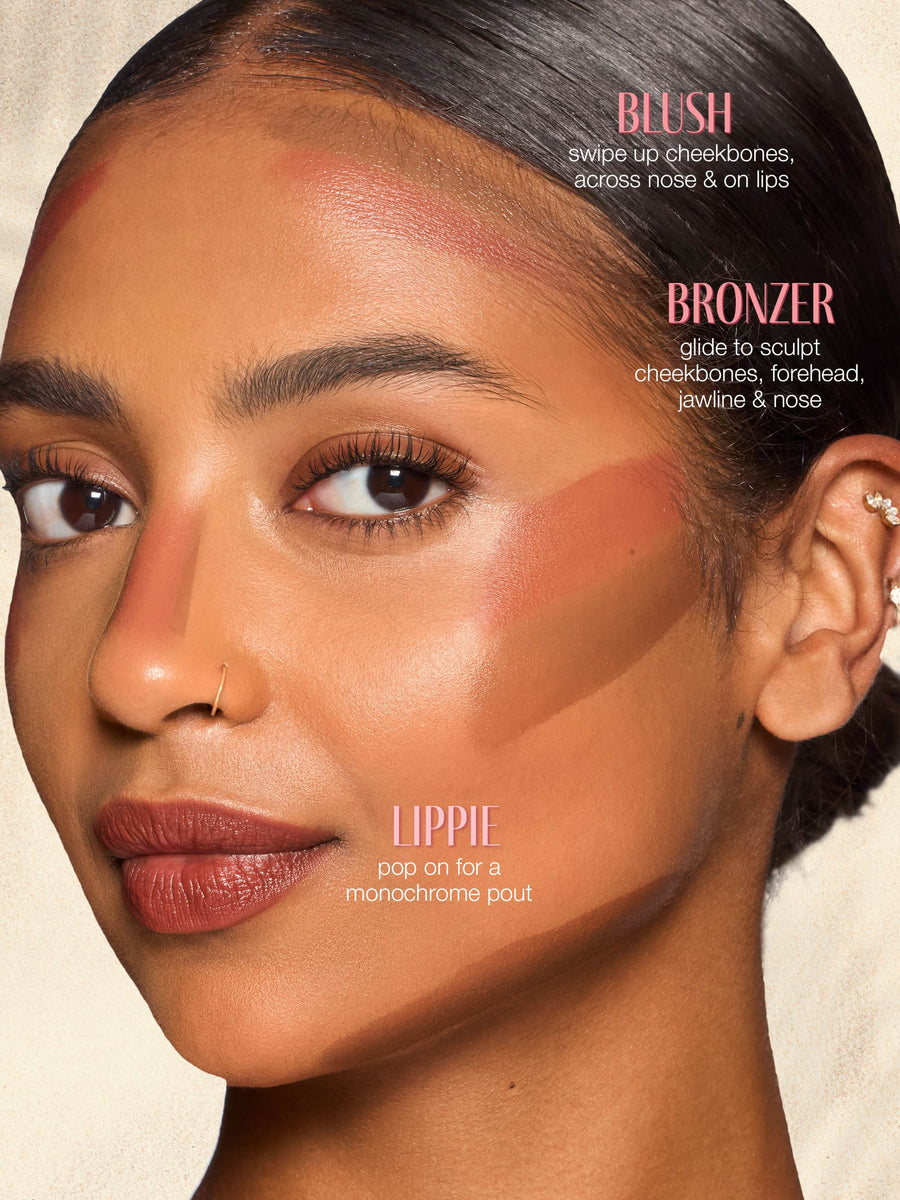 Close-up of a woman's face with makeup application instructions for tarte double ended multi stick on a beige background
