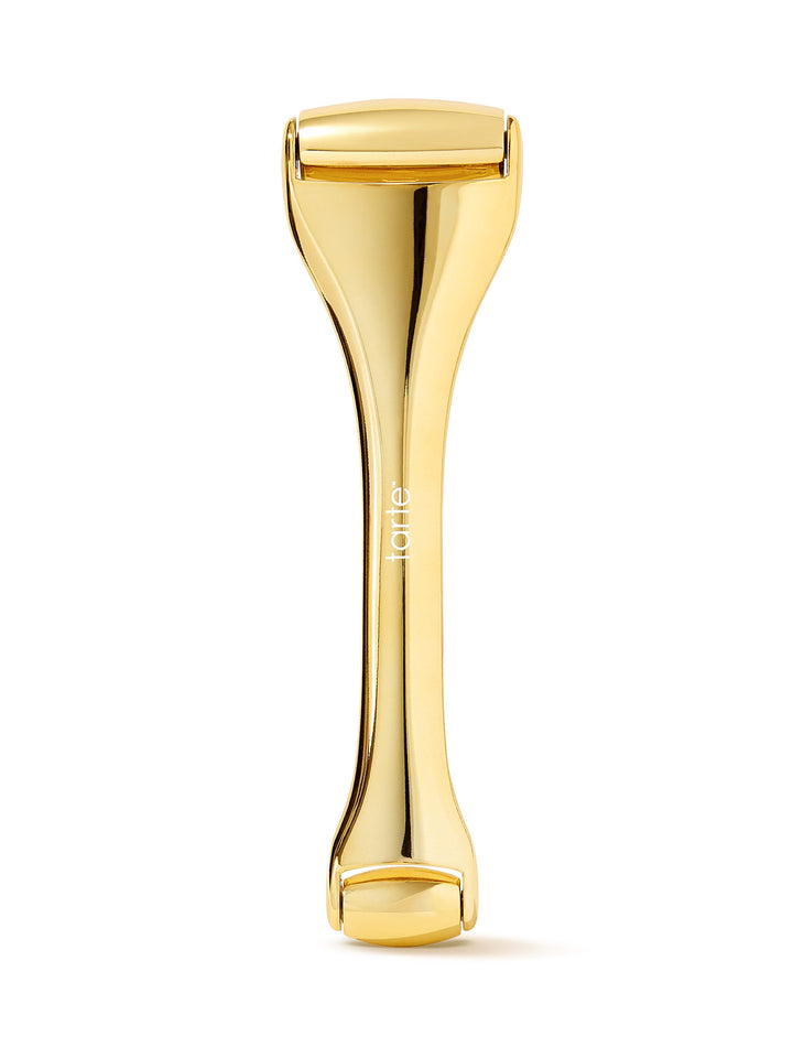 Gold-colored skin exfoliator on a white background