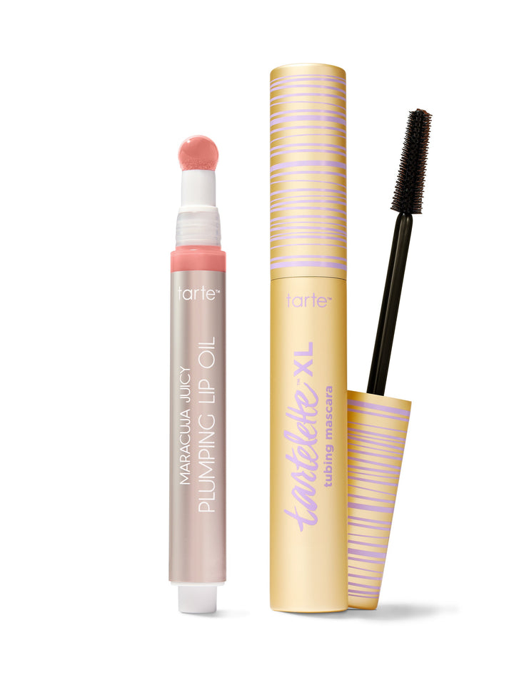 Tarte cosmetic products including lip oil, mascara, and eyeliner on a white background