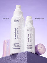 Tarte Shape Tape Stay Spray bottles in full-size and travel-size on a purple background