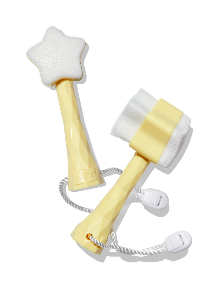 Two yellow and white cleaning brushes on a white background