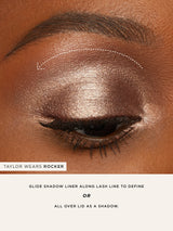 Close-up of an eye with makeup application instructions on a brown background