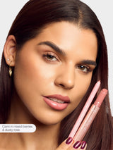 woman holding maracuja juicy lip liner, and maracuja juicy lip plump,
