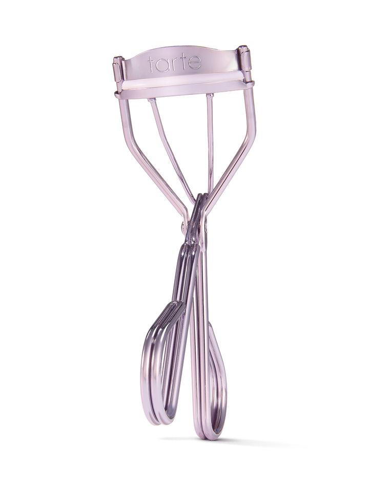 Lash curler with 'tarte' branding on a white background
