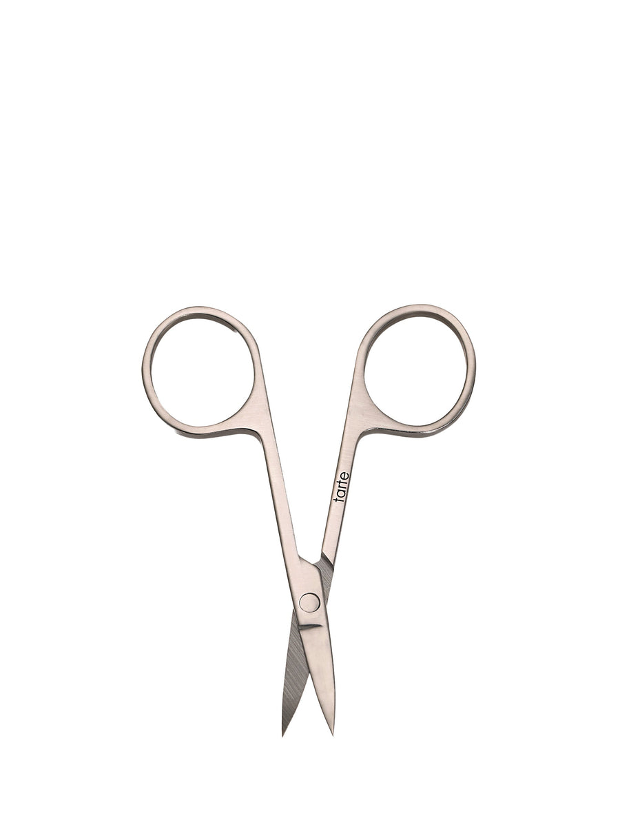 Pair of silver embroidery scissors on a white background