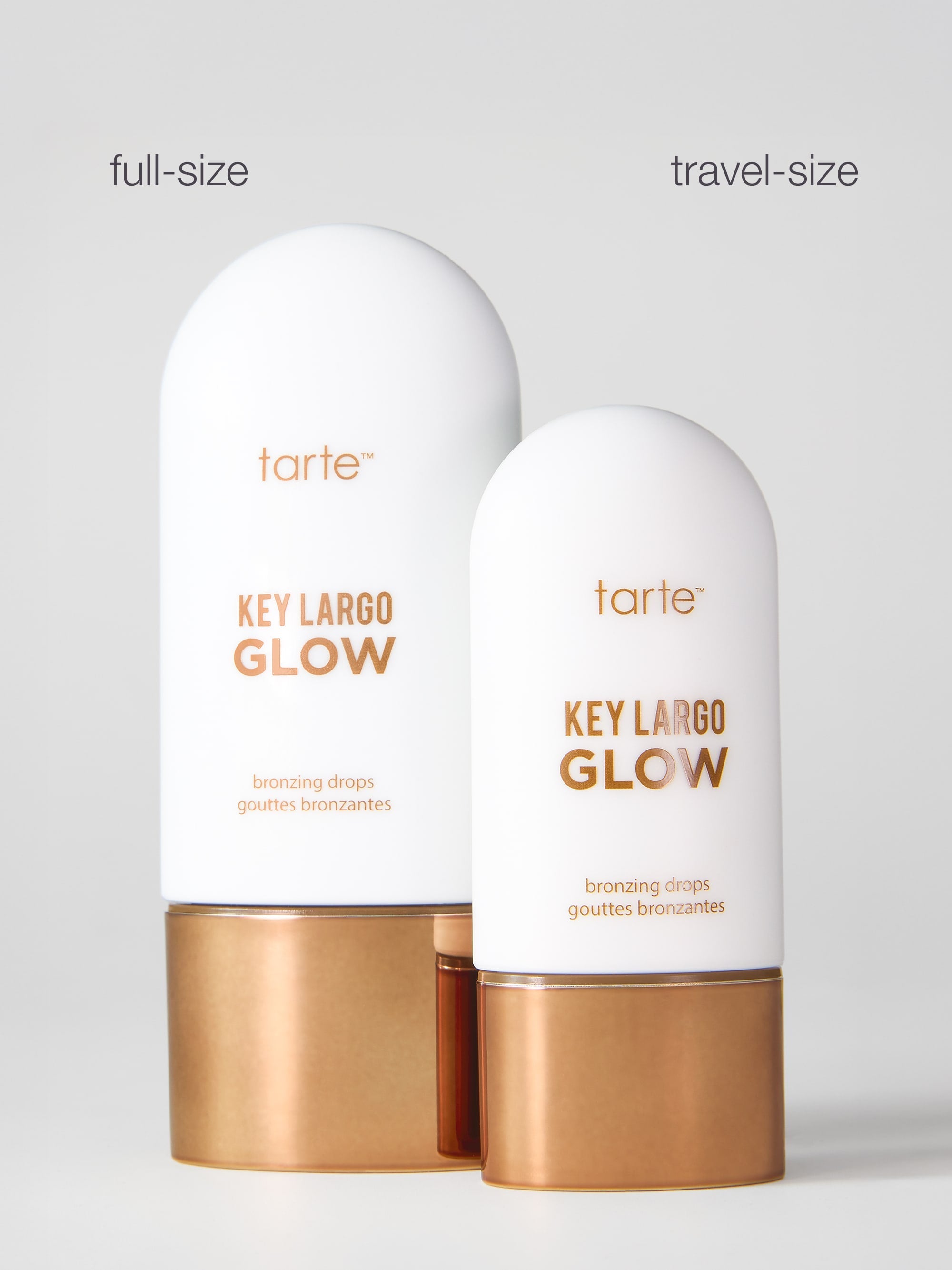 Tarte Key Largo Glow bronzer drops in full-size and travel-size on a light gray background