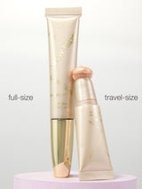 Full-size and travel-size cosmetic tubes on a light gray background