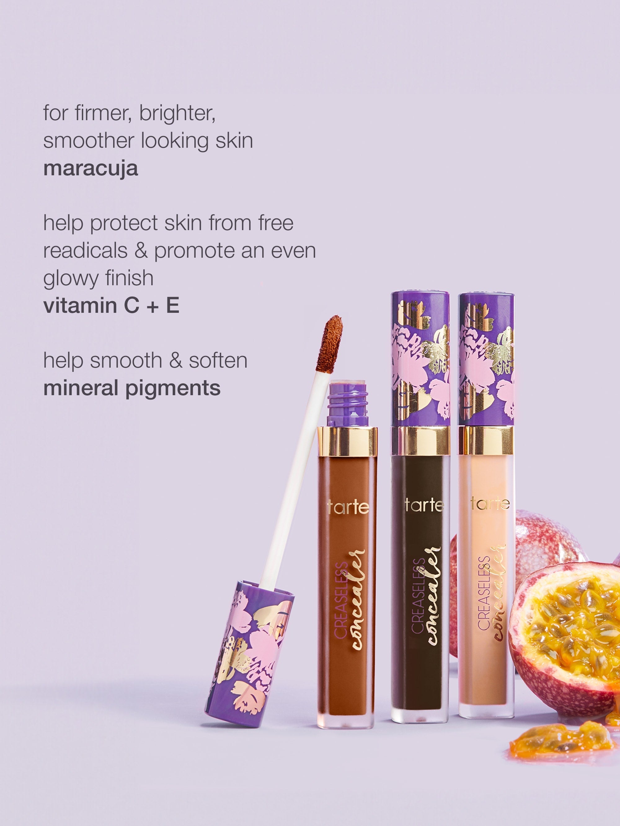 Three Tarte Cosmetics concealers stand upright, one with an open applicator, on a lavender surface next to a halved maracuja fruit. Text highlights benefits: firmer, brighter skin, protects with vitamins C + E, smooth mineral pigments.