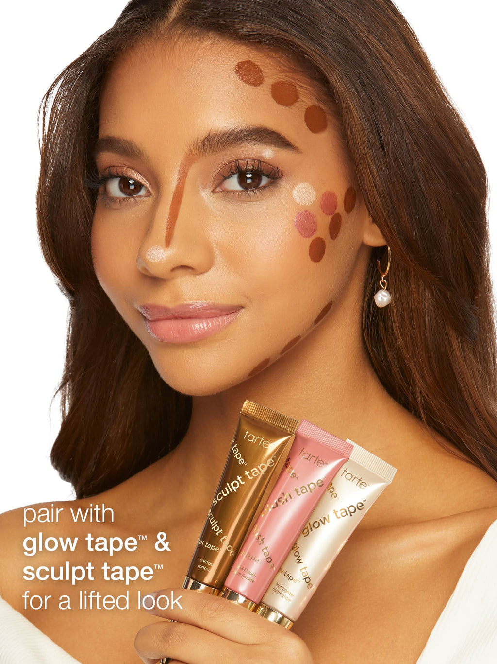 Woman with makeup swatches on her face, promoting cosmetic products.