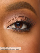 Close-up of a person's eye with makeup, featuring the brand 'tarte'.
