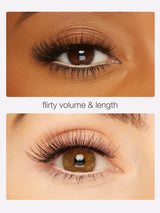 Close-up of an eye with false eyelashes labeled 'flirty volume & length' on a beige background.