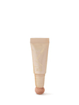 Beige skincare tube with a textured cap on a white background