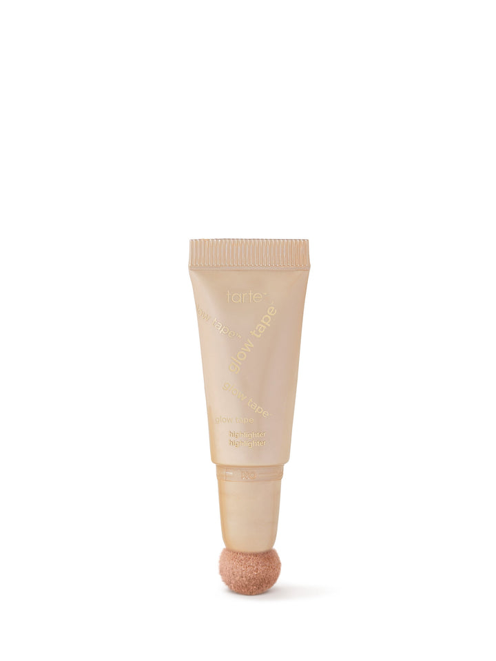 Beige skincare tube with a textured cap on a white background