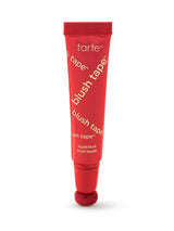 Red tube of tarte blush tape on a white background