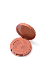 Open blush compact with 'tarte' branding on a white background