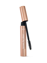 Tarte brow product with black bristle brush on a white background
